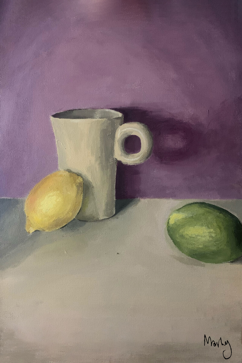 Still life with mug, lemon and lime.